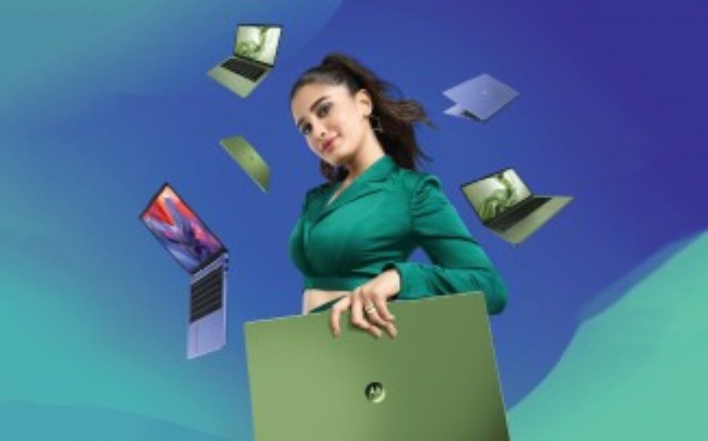 A Motorola Moto Pad 60 Pro tablet in Pantone Bronze Green is displayed at an angle, showcasing its 12.7-inch 3K LTPS LCD screen. The tablet is accompanied by the Moto Pen Pro stylus, placed beside it, with a sleek, modern design and slim bezels visible. The background is a clean, white surface.